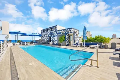 a swimming pool on the roof of a building at Stylish Studio in South Beach with Ocean Views in Miami Beach