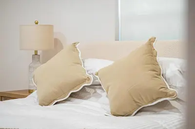 a bed with two pillows on top of it at Chic Villa Nina 2 bedrooms 2 baths in Miami! in North Miami
