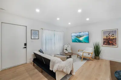 a living room with a couch and a table at Chic Villa Nina 2 bedrooms 2 baths in Miami! in North Miami