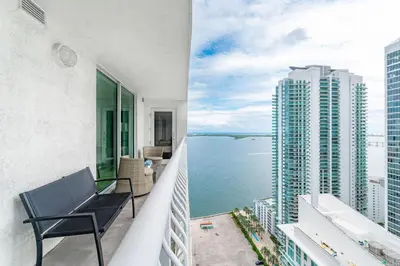 a balcony with a view of the water at 3 bedroom stunning apt brickell in Miami