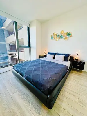 a bedroom with a large bed and a large window at Miami Downtown 2BR Pool-Gym-Views-Great Location in Miami