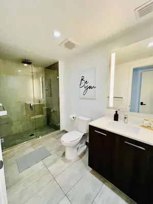 a bathroom with a toilet and a sink and a shower at Miami Downtown 2BR Pool-Gym-Views-Great Location in Miami