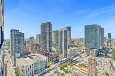 an aerial view of a city with tall buildings at Lux Miami Studio City Bay Views in Miami
