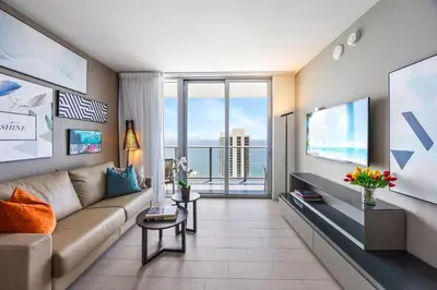 a living room with a couch and a large window at 2 BDR Penthouse Ocean Front View Hyde Beach House in Hollywood