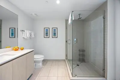 a bathroom with a shower and a toilet and a sink at 2 BDR Penthouse Ocean Front View Hyde Beach House in Hollywood