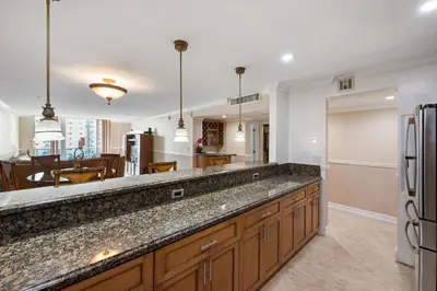 a kitchen with a large counter top and a dining room at Entire Condominium in Sunny Isles in Sunny Isles Beach