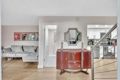a living room with a couch and a mirror at Coconut Grove Haven Family in Miami