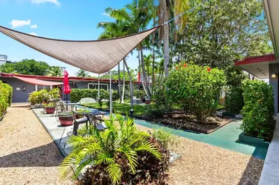 a hammock in a garden with plants and trees at 1BR Studio Parking, Pet Friendly and BBQ Area in Hollywood