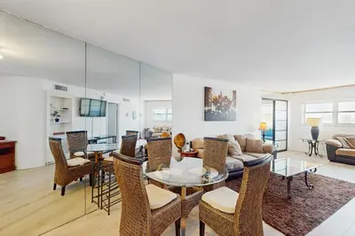 a living room with a table and chairs at Miami Lux Haven in Miami Beach