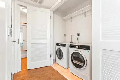 a white laundry room with a washer and dryer at Luxury Condo at Trésor Miami Beach in Miami Beach