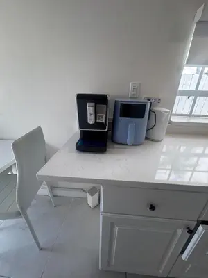 a white desk with a microwave on top of it at Tempurpedic Queen - Laundry, Parking & EV Charger in Hollywood