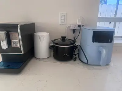 a kitchen with a coffee maker and a microwave at Tempurpedic Queen - Laundry, Parking & EV Charger in Hollywood