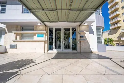 a building with awning over the entrance to a building at South Beach Luxury, 2 Bedroom, Across from Beach in Miami Beach
