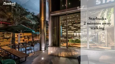 a restaurant with tables and chairs in front of a window at South Beach Luxury, 2 Bedroom, Across from Beach in Miami Beach