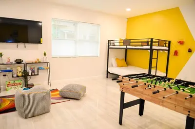 a room with two bunk beds and a table at Vibrant 4bd 2ba Miami Home w POOL in Miami