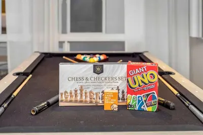 a pool table with a box of chalk and chopsticks at Firepit, Beach, Basketball, LuxuryVilla in Palmetto Bay