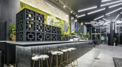 a lobby with a counter with pillows on it at Heart of Downtown Miami in Miami