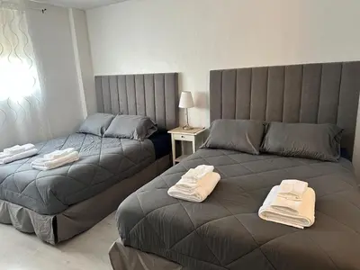 a bedroom with two beds with towels on them at Beatiful apartment 2nd Floor - SRT 3143 in Sunny Isles Beach