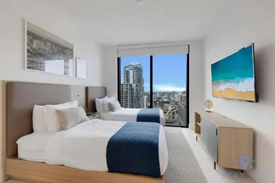 a bedroom with two beds and a large window at Condo Downtown in Miami