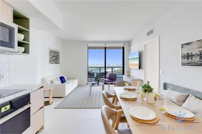 a kitchen and living room with a table and chairs at Condo Downtown in Miami