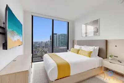 a bedroom with a large bed and a large window at Condo Downtown in Miami