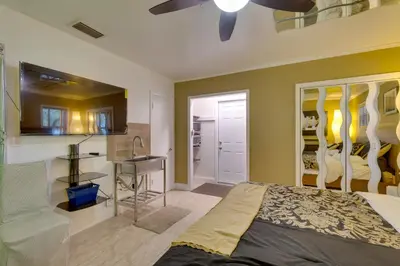 a bedroom with a bed and a desk in it at Fort Lauderdale Studio Near Beaches and Downtown in Fort Lauderdale