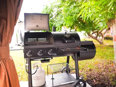 a grill with a laptop on top of it at Casa Hard Rock Stadium in Miami Gardens