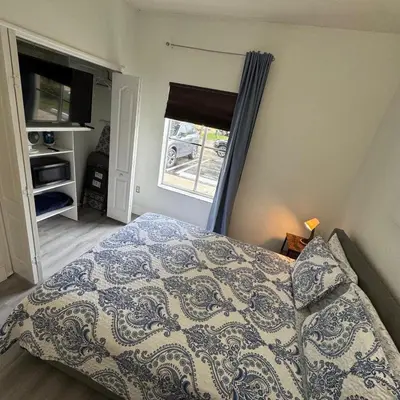a bedroom with a bed and a window at Room w Private Entrance near Airport, Dolphin Mall & FIU in Miami