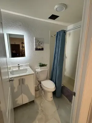 a bathroom with a toilet and a sink and a shower at Room w Private Entrance near Airport, Dolphin Mall & FIU in Miami