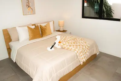 a bedroom with a bed with a stuffed animal on it at Comfortable 2BR Apartment with Pool and Gym, Steps from Jackson Memorial in Miami