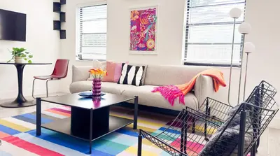 a living room with a couch and a table at The Chill Pill - Wilton Drive and Jacuzzi in Fort Lauderdale