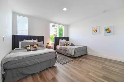 a bedroom with two beds and a window at Family-Friendly Townhouse w Private Parking Included in Miami