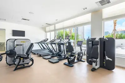 a gym with treadmills and elliptical machines at Tiffany Shoreline - PH Floor, Ocean View, Walk to beach in Fort Lauderdale