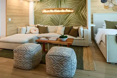 a living room with a couch and a table at Skyline Studio at Roney Palace - 1429 in Miami Beach