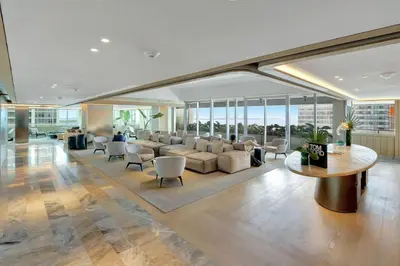 a living room with a couch and a table and chairs at ★Luxury Studio with king bed+Free Parking+Netflix★ in Miami