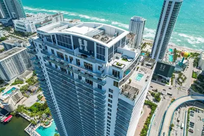 an aerial view of a tall building next to the ocean at 2BR Ocean Penthouse - Private Terrace & Hot Tub in Hollywood