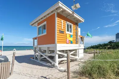 a tiny house sitting on the beach at Sunny Balcony - Beautiful Stay for 2 with Ocean Views & Resort Amenities in Hollywood