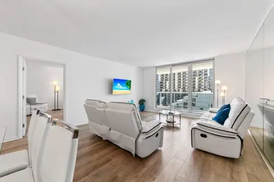 a living room with two chairs and a couch at Oasis on the Beach - For 4 in Miami Beach