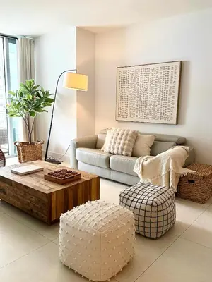 a living room with a couch and a coffee table at Cosy 1 Bedroom Breathtaking Ocean Views at LYFE Resort in Hollywood