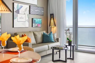 a living room with a couch and a table at 5-BR Retreat Resort & Valet Included 14 Guests in Hollywood