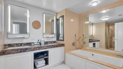 a bathroom with two sinks and a bath tub at Ritz-Carlton 2br 17th fl Penthouse Hotel Condo in Fort Lauderdale