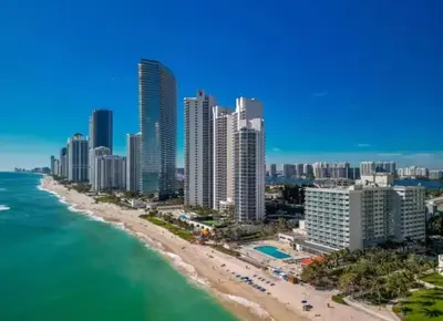an aerial view of a beach and buildings at Beachfront Studio - Marco Polo Sunny Isles -2Beds in Sunny Isles Beach
