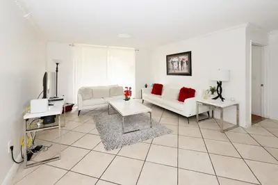a living room with a couch and a table at Apartment 2 Bedrooms at Yacht Club of Aventura in Miami