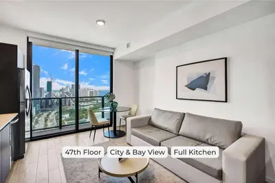a living room with a couch and a table at 4704 Lux Miami Studio City Bay Views in Miami