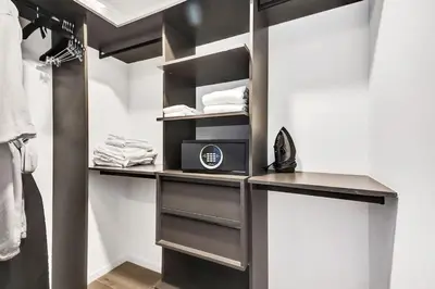 a walk in closet with a desk and a microwave at 4604 Lux Miami Studio City and Bay Views in Miami