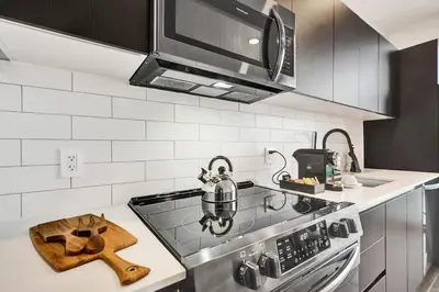 a kitchen with a stove with a tea kettle on it at 4604 Lux Miami Studio City and Bay Views in Miami