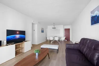 a living room with a couch and a table at Condo w/2 Queen beds & Ocean View | Tides in Hollywood