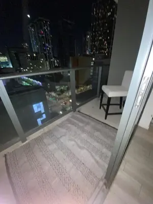 a balcony with a view of a city at night at Comfortable apartment in Downtown Miami in Miami