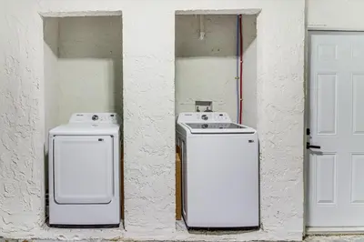two old washing machines sitting next to a door at 5 Mi to Beach Group Getaway with Yard in Miami in Miami