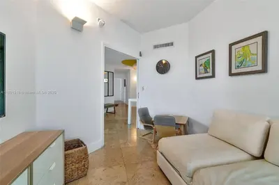 a living room with a couch and a table at High-Rise Haven by the Sea in Sunny Isles Beach